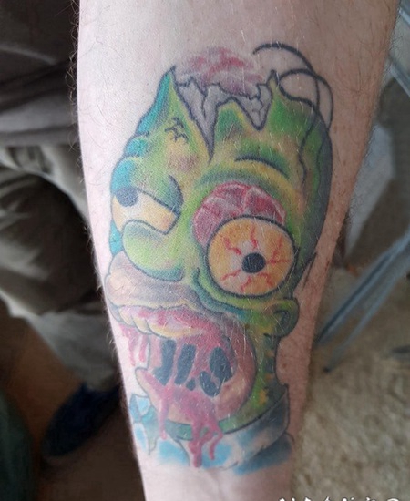 纹身卡通人物 男生手臂上恐怖的卡通人物纹身图片