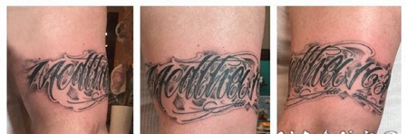 花体英文纹身 男生手臂上黑色纹身花体英文纹身图片