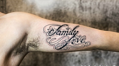 手臂艺术感十足的花体字英文纹身图案