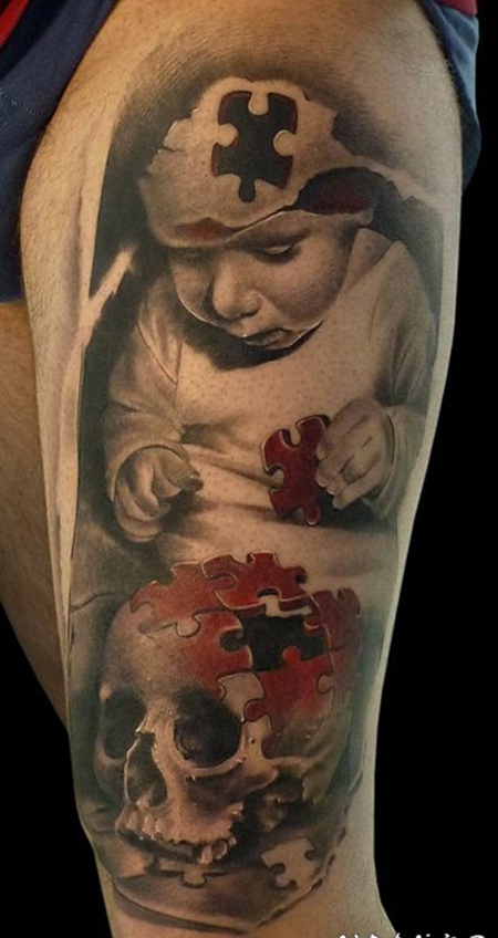 手臂诡异拼图骷髅小孩肖像创意纹身图片