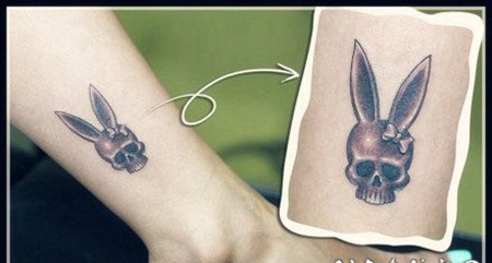女孩子腿部一张兔耳朵的骷髅纹身图案