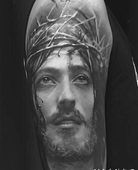 手臂耶稣肖像个性纹身图案