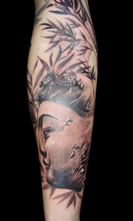 小臂上的佛像竹子纹身