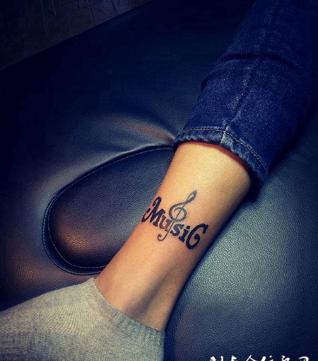 腿部个性音乐符号纹身图案