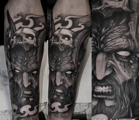 壮观的黑色恶魔人与骷髅手臂纹身图案