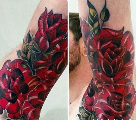 手臂大红色玫瑰与树叶纹身图案