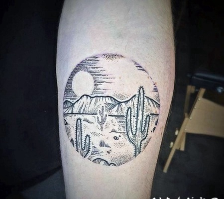 雕刻风格黑色点刺圆形沙漠手臂纹身图案