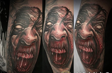 手臂恐怖风格的恶魔脸纹身图案