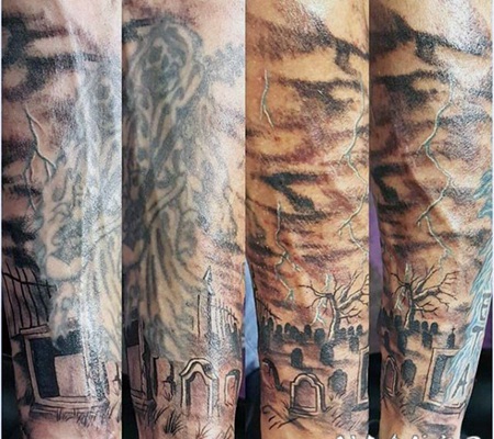 手臂黑色的旧墓地和天空纹身图案