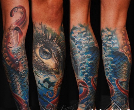 小腿彩色的女性眼睛和鲨鱼纹身图案