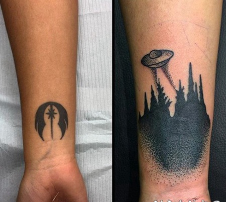 手腕黑色的各种神秘外星飞船和符号纹身图案