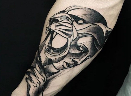 点刺风格的黑色狮子头和女人手臂纹身图案