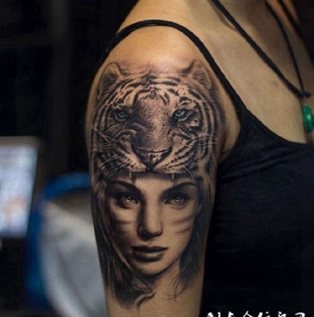 手臂上的虎女纹身图案
