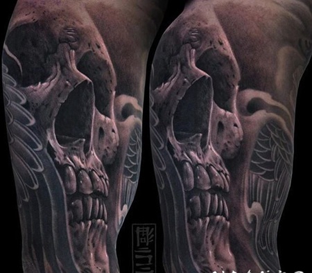 黑灰风格神秘的骷髅与天使翅膀手臂纹身图案