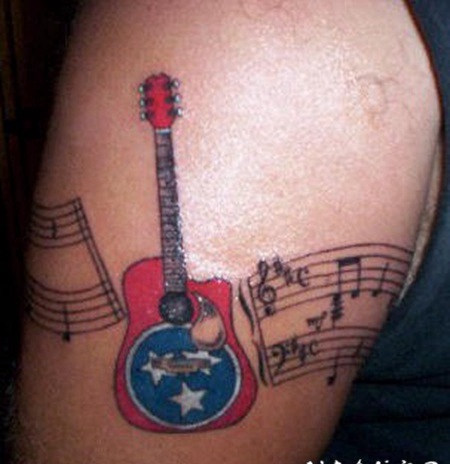 美国风格的吉他与音符纹身图案