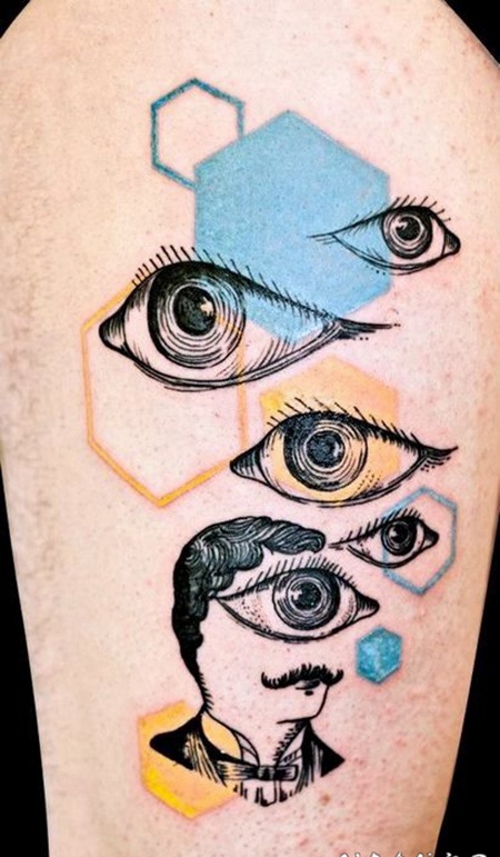 手臂彩色神秘的眼睛与几何图形纹身图案