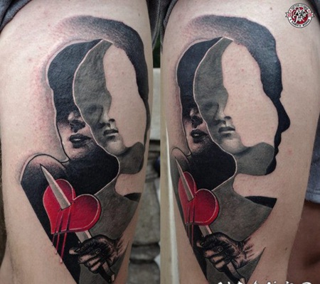 大腿抽象风格的彩色心形和匕首人像纹身图案