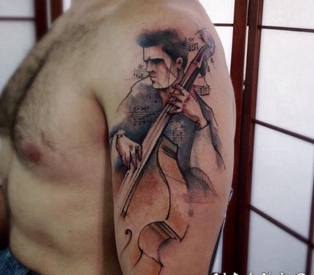 手臂抽象风格的男性音乐家纹身图案