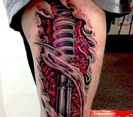 大腿3D撕皮机械和彩色肌肉纹身图案