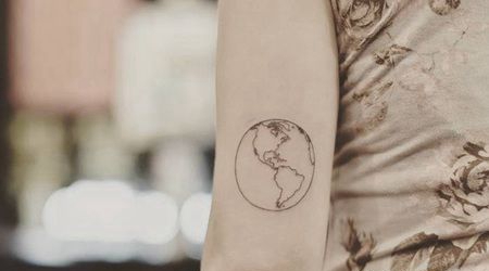 胳膊外侧小清新线条地球纹身图案
