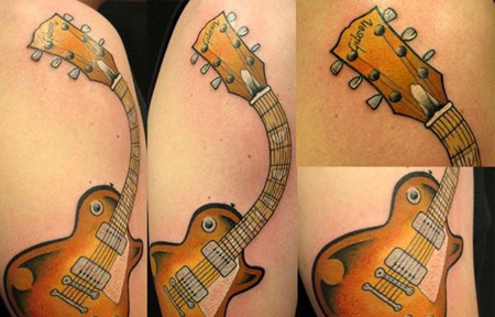 肩部弯曲的吉他纹身图案