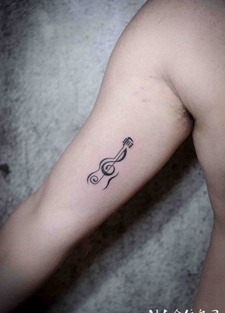手臂个性音符纹身图案