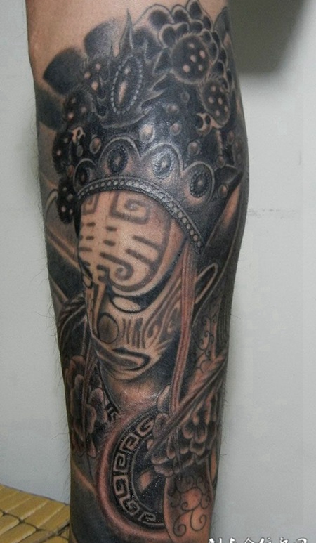 小腿上的七爷八爷脸谱纹身