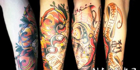 小臂上握着骷髅的手纹身