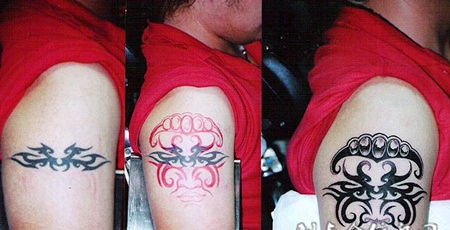 大臂修改人脸图腾纹身