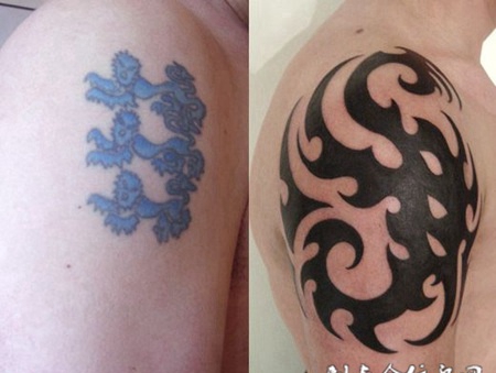 大臂修改抽象图腾纹身