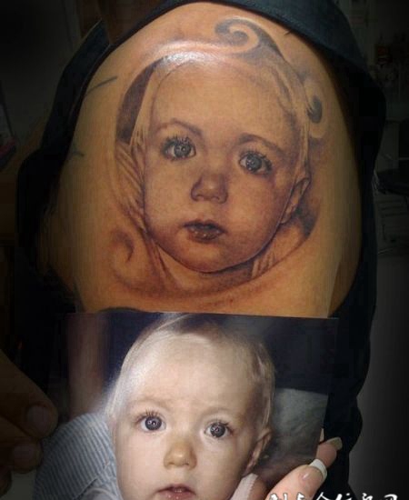 大臂娃娃纹身图案