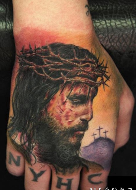 手背上的耶稣头像纹身图案