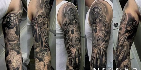 花臂上带着防毒面具的人物纹身图案