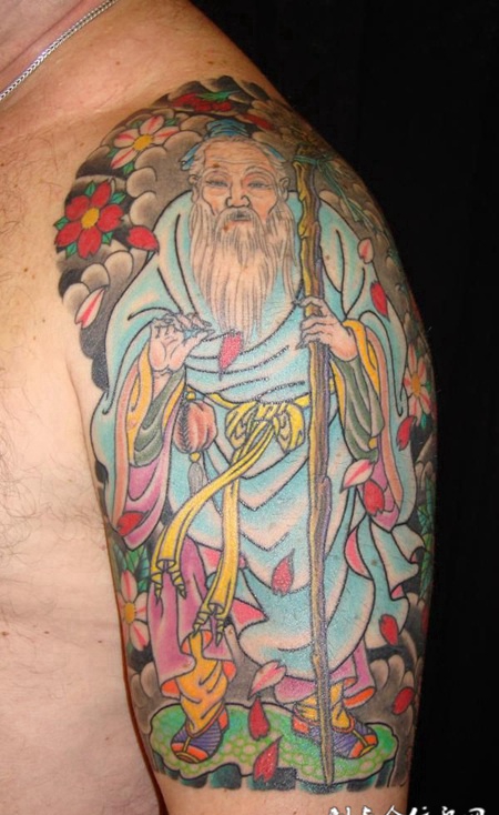 大臂上的寿星纹身图案