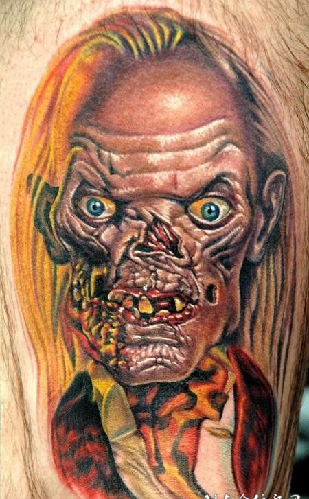 大臂上的丧尸骷髅纹身图案