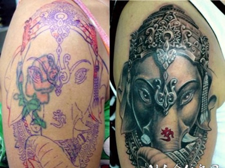 大臂上的遮盖象神纹身图案