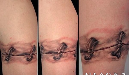 大臂上的缝合伤口纹身图案