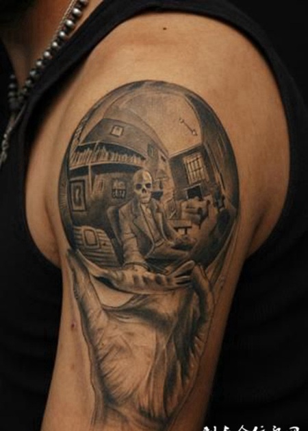 大臂上的水晶球骷髅纹身图案缩略频道推荐图