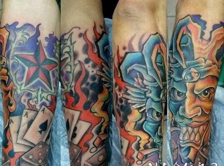 小臂上的扑克恶魔纹身图案