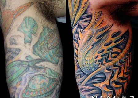 大臂上的机械遮盖纹身图案