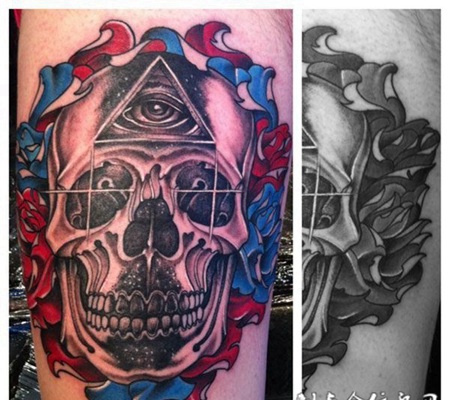 大臂上的骷髅头眼睛纹身图案