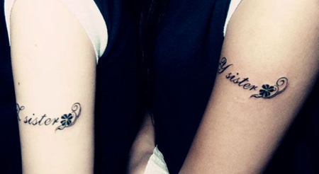 大臂情侣四叶草纹身图案