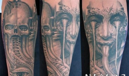 小臂上的骷髅和恶魔纹身图案