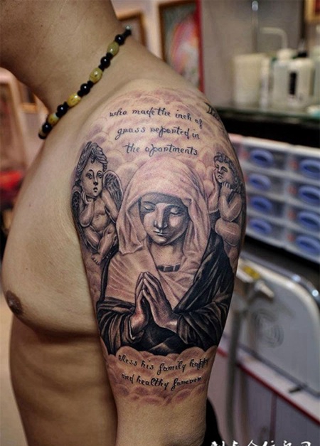 大臂上的修女天使纹身图案