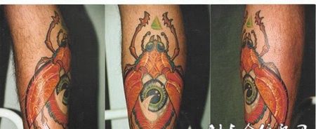 小臂上的眼睛甲壳虫纹身图案