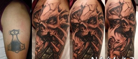 大臂上的遮盖恶魔纹身图案