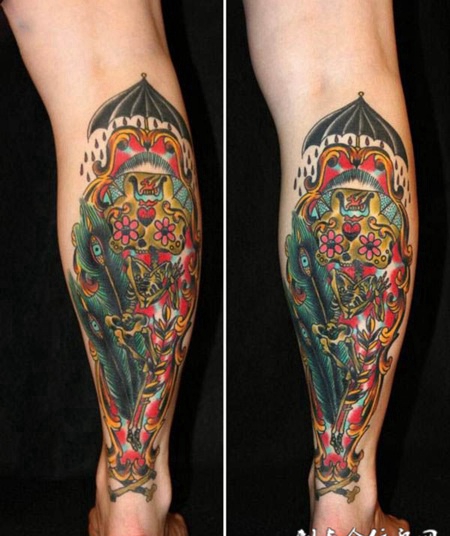 小腿上打伞的锁头纹身图案