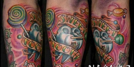小臂上的棒棒糖桃心纹身图案