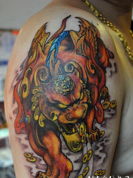 貔貅纹身男生手臂图片