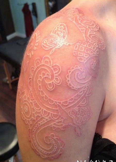 鸽子血花纹手臂纹身图案效果图